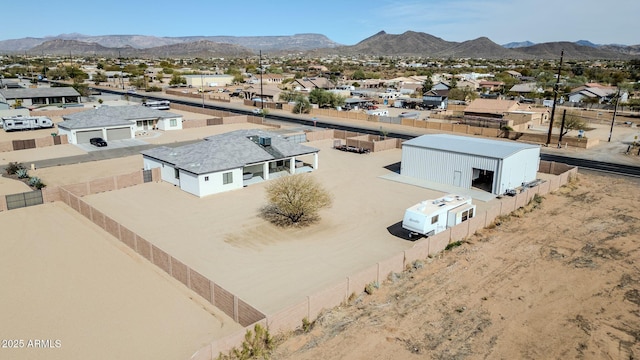 drone / aerial view featuring a residential view and a mountain view