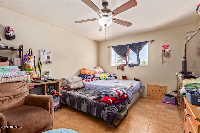 tiled bedroom with ceiling fan