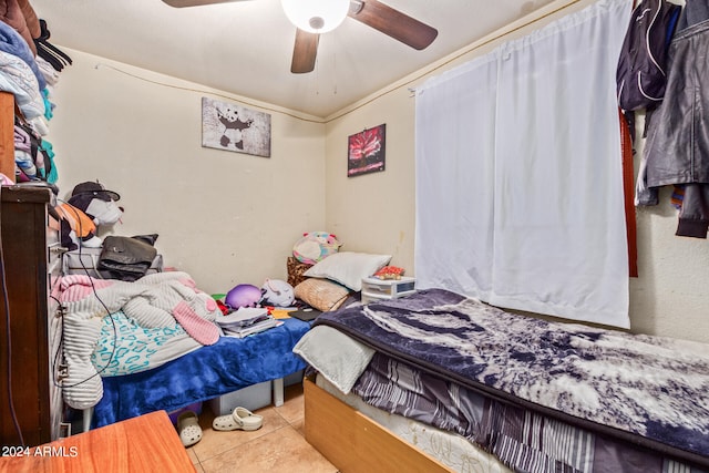 bedroom with tile flooring and ceiling fan