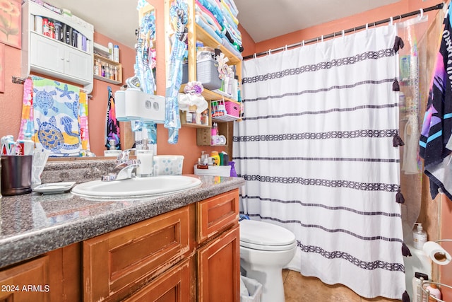 bathroom with toilet and oversized vanity