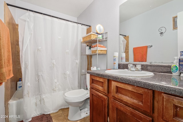 full bathroom with tile floors, shower / bath combo, toilet, and vanity