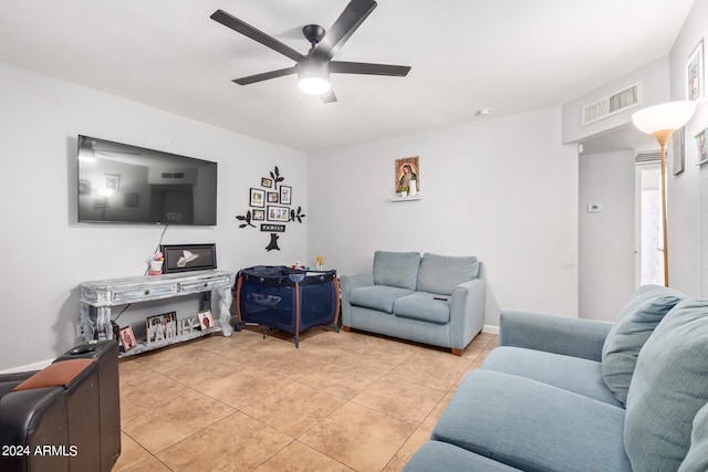 living room featuring ceiling fan and light tile floors