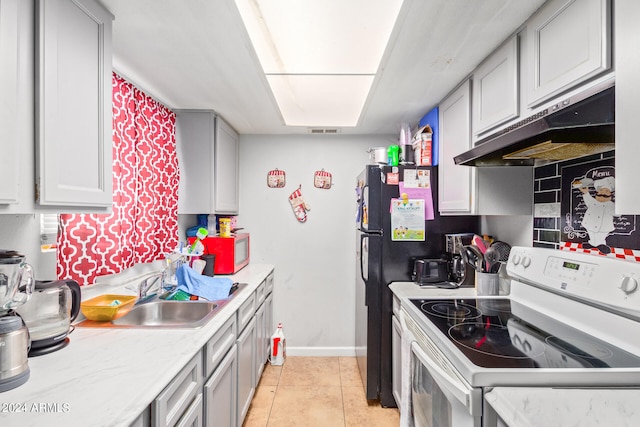 kitchen featuring sink, white appliances, light tile flooring, and gray cabinets