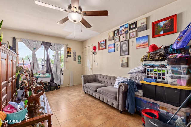 tiled living room with ceiling fan