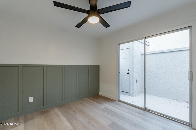 empty room featuring ceiling fan and light wood-type flooring