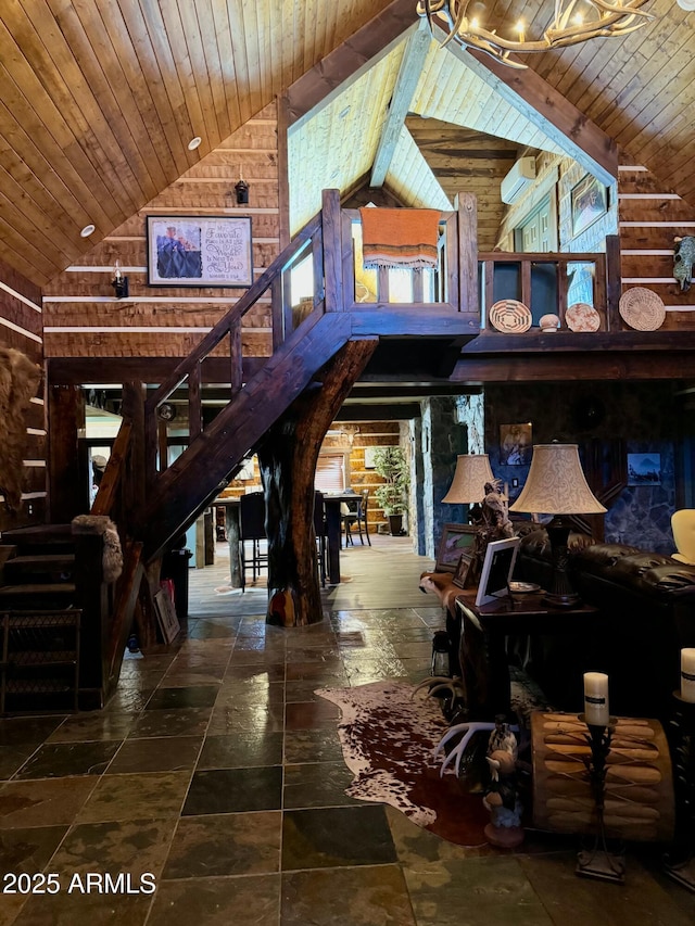 interior space featuring beam ceiling, high vaulted ceiling, wood ceiling, and wood walls