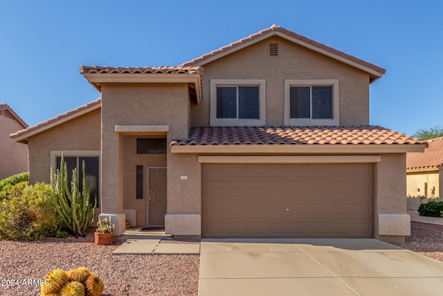 view of front of property with a garage