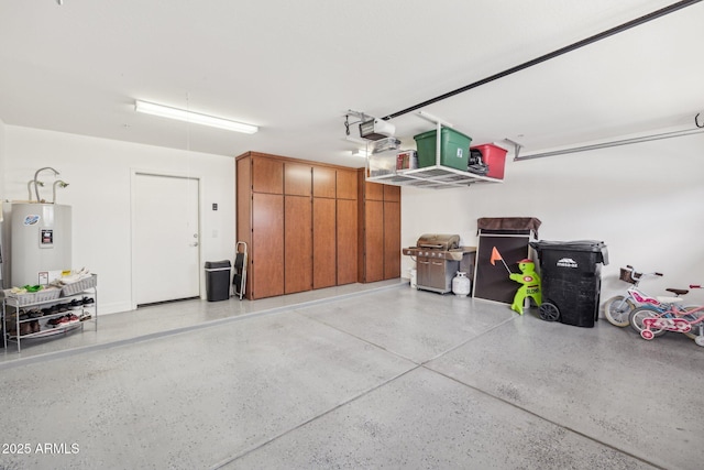 garage featuring a garage door opener and water heater