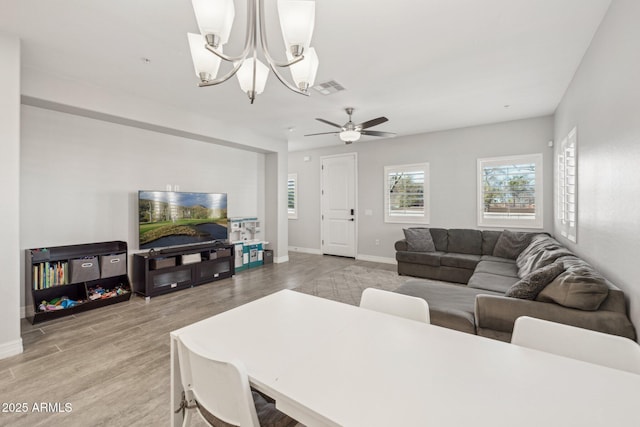 living room featuring ceiling fan and wood-type flooring