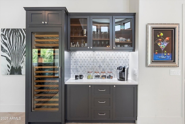 bar featuring beverage cooler and wet bar