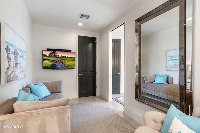 living area featuring recessed lighting, visible vents, baseboards, and light tile patterned floors