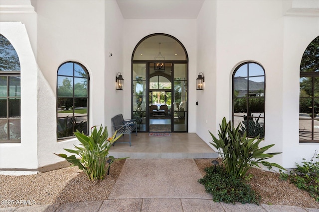 property entrance featuring stucco siding