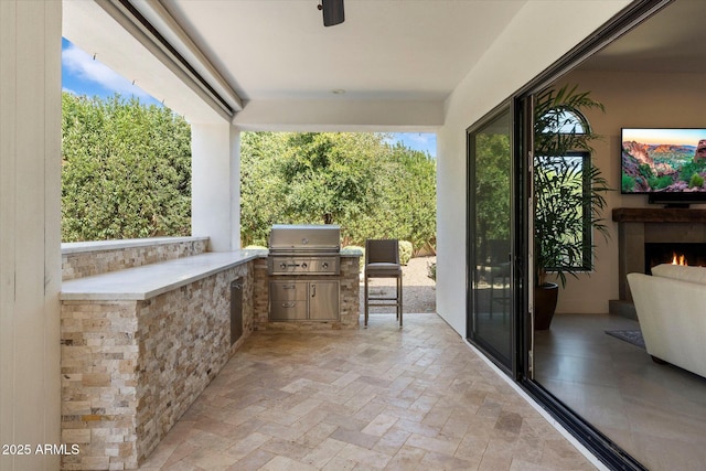 view of patio / terrace featuring exterior kitchen and grilling area