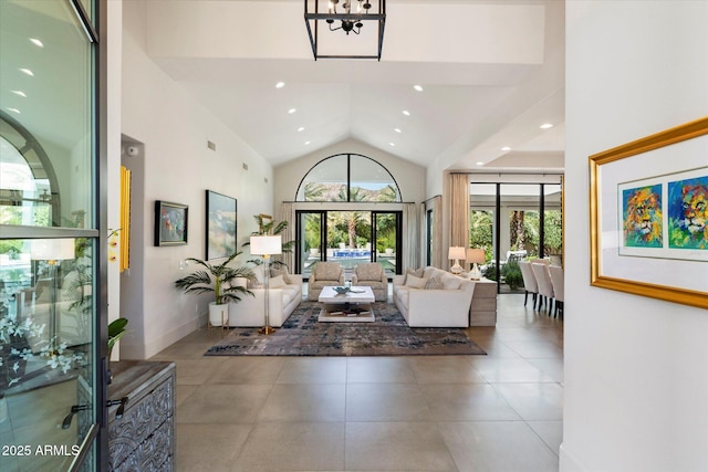 entrance foyer with tile patterned floors, visible vents, high vaulted ceiling, recessed lighting, and baseboards