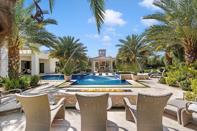 outdoor pool featuring a gazebo and a patio area