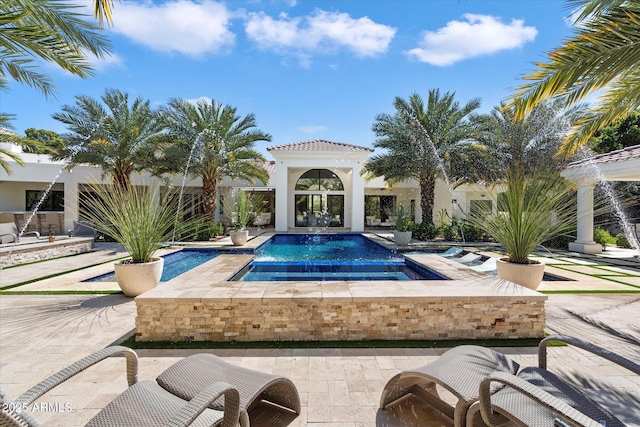 view of swimming pool featuring a patio area