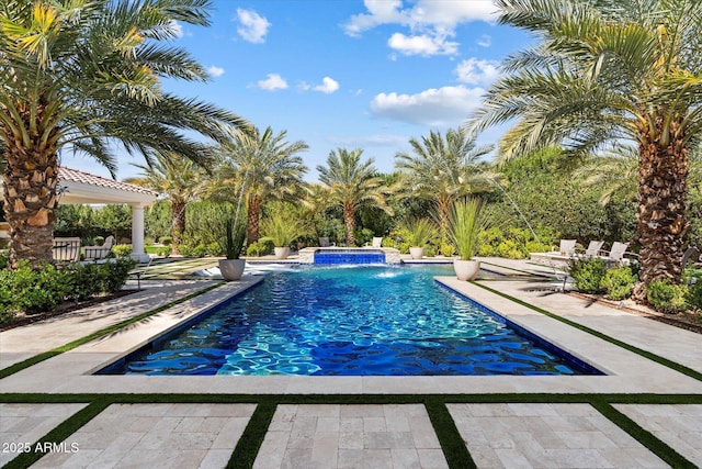 outdoor pool featuring a patio