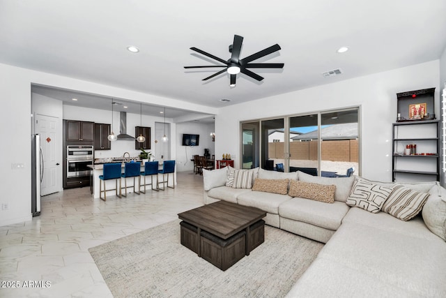 living room featuring ceiling fan