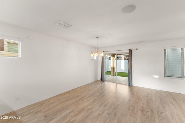 1255 N Banning, Mesa, AZ 85205 - empty room with plenty of natural light, light wood-style floors, and visible vents