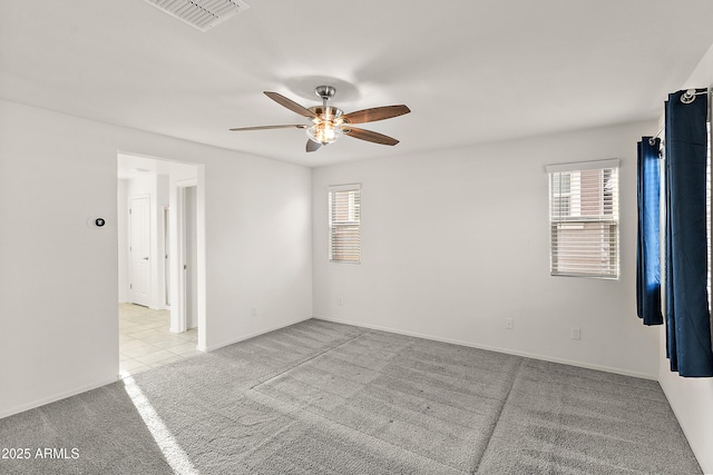 1255 N Banning, Mesa, AZ 85205 - empty room featuring plenty of natural light, light carpet, a ceiling fan, and visible vents