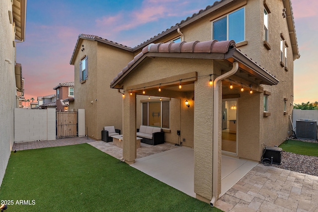 1255 N Banning, Mesa, AZ 85205 - rear view of property featuring fence, central AC, a patio area, stucco siding, and a gate