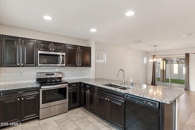 1255 N Banning, Mesa, AZ 85205 - kitchen with a peninsula, plenty of natural light, stainless steel appliances, and a sink