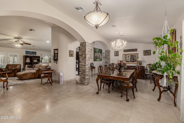 12837 N 68th St, Scottsdale, AZ 85254 - dining room featuring arched walkways, a ceiling fan, decorative columns, a chandelier, and lofted ceiling