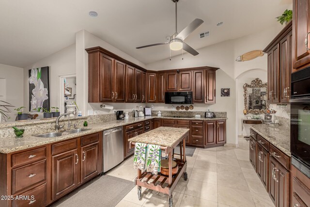 12837 N 68th St, Scottsdale, AZ 85254 - kitchen with black appliances, vaulted ceiling, a sink, a ceiling fan, and light stone countertops