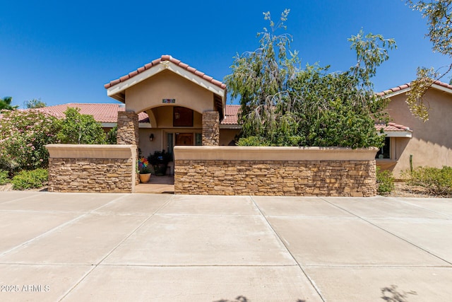12837 N 68th St, Scottsdale, AZ 85254 - view of front of house with a tiled roof and stucco siding