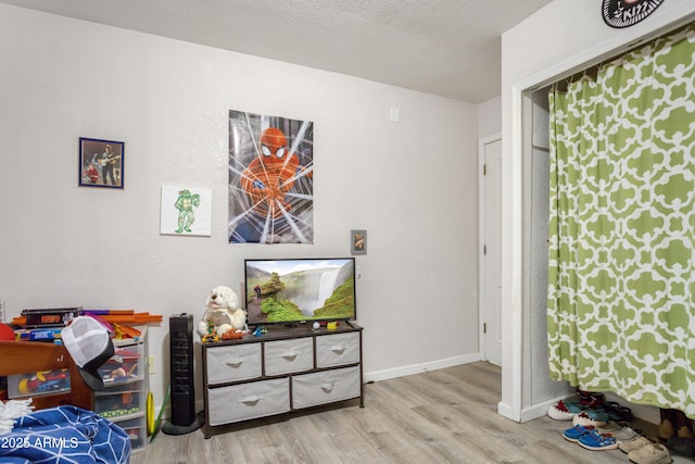 8730 E Barataria Blvd, Sierra Vista, AZ 85650 - bedroom with wood finished floors and baseboards