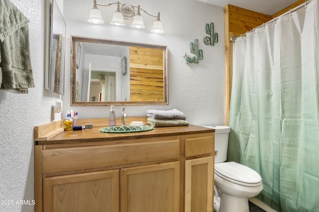 8730 E Barataria Blvd, Sierra Vista, AZ 85650 - full bath featuring a textured wall, toilet, vanity, and a shower with shower curtain
