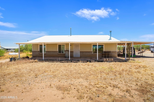 8730 E Barataria Blvd, Sierra Vista, AZ 85650 - view of front of house with brick siding and metal roof