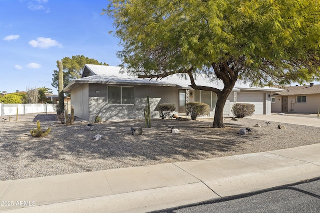 ranch-style home with a garage