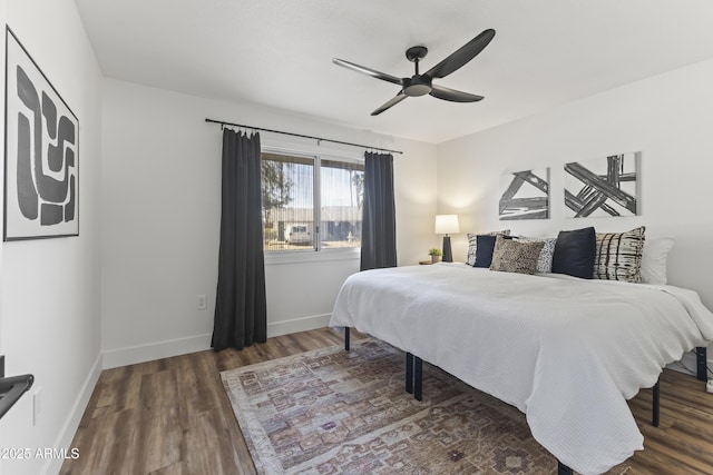 bedroom featuring dark hardwood / wood-style floors and ceiling fan