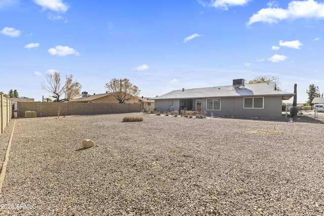 rear view of property with cooling unit