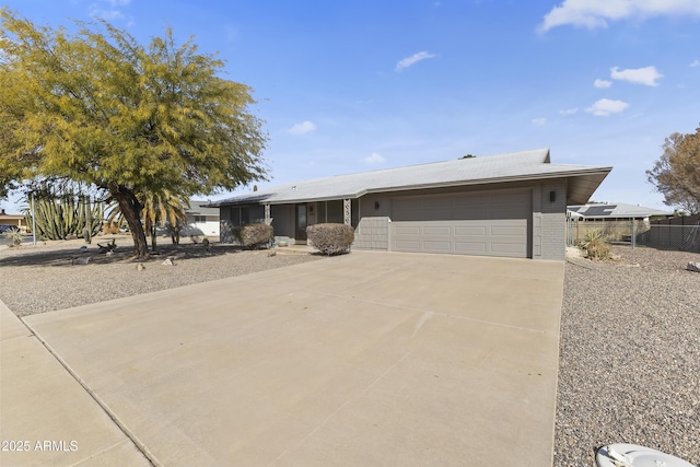 ranch-style house featuring a garage