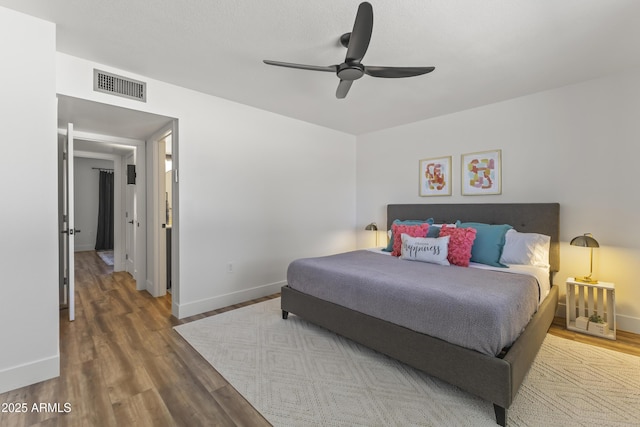 bedroom featuring wood-type flooring and ceiling fan