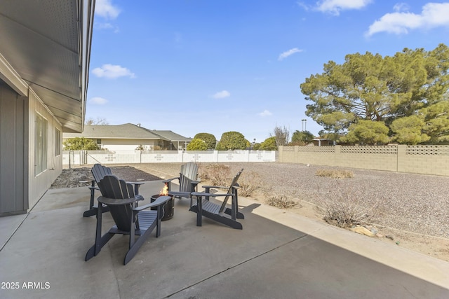 view of patio / terrace with an outdoor fire pit