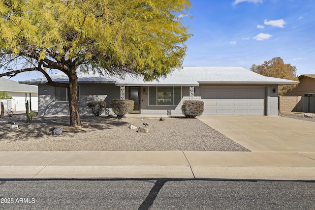 ranch-style home featuring a garage