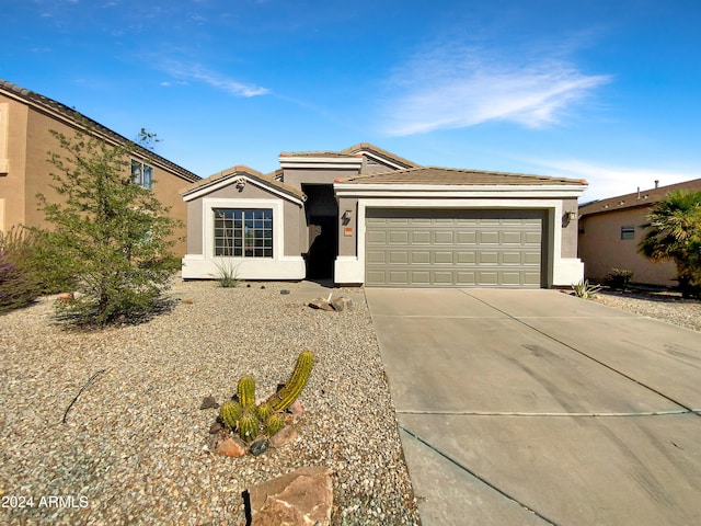 single story home with a garage