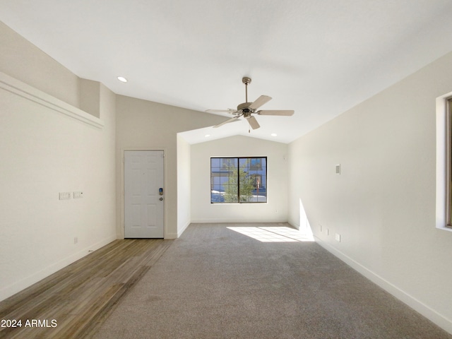 unfurnished room featuring hardwood / wood-style floors, ceiling fan, and lofted ceiling