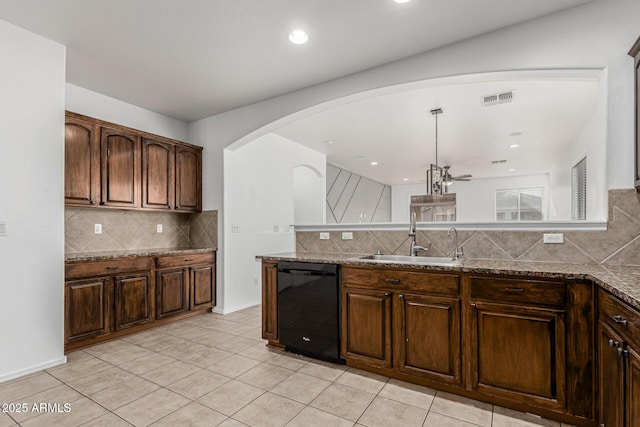 28232 N Abby Cir, San Tan Valley, AZ 85143 - kitchen featuring dishwasher, a sink, backsplash, arched walkways, and stone countertops