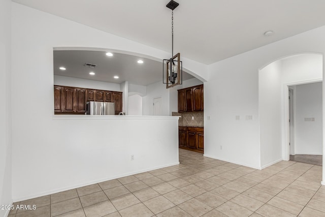 28232 N Abby Cir, San Tan Valley, AZ 85143 - unfurnished living room with arched walkways, light tile patterned floors, and recessed lighting