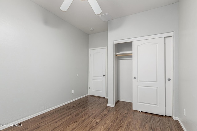 28232 N Abby Cir, San Tan Valley, AZ 85143 - unfurnished bedroom with wood finished floors, a closet, baseboards, and ceiling fan