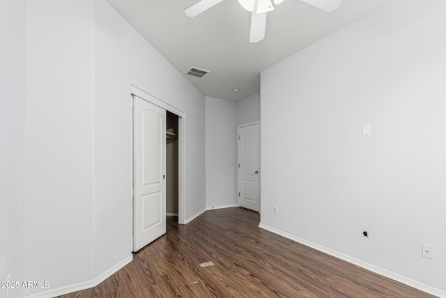 28232 N Abby Cir, San Tan Valley, AZ 85143 - unfurnished bedroom featuring wood finished floors, baseboards, a closet, and ceiling fan