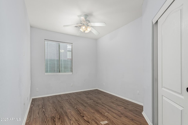 28232 N Abby Cir, San Tan Valley, AZ 85143 - unfurnished bedroom with dark wood-style flooring, baseboards, and a ceiling fan