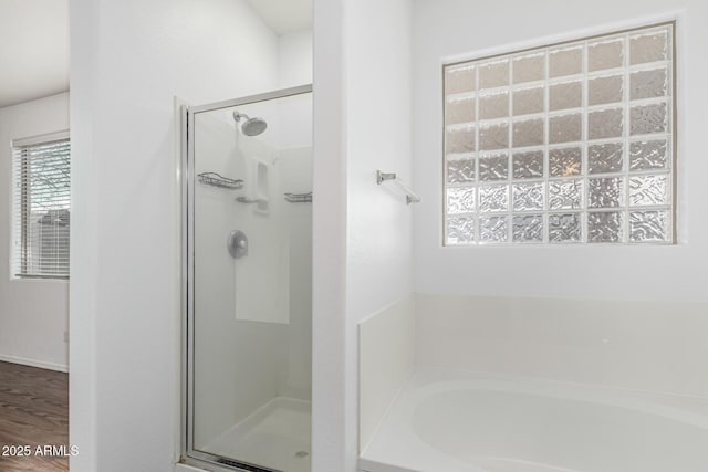 28232 N Abby Cir, San Tan Valley, AZ 85143 - full bathroom featuring a stall shower, a bath, and wood finished floors