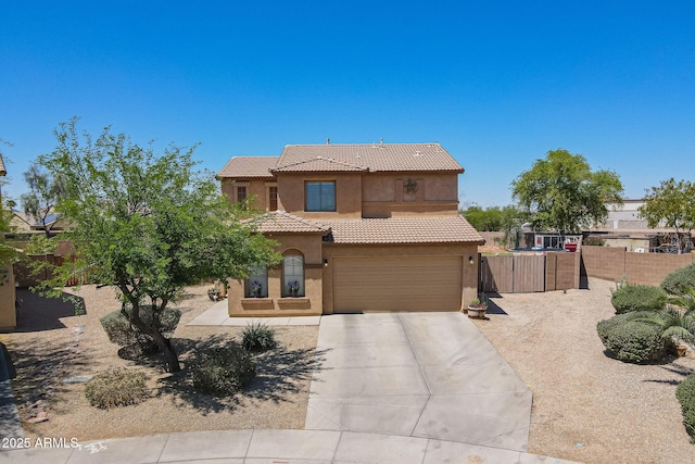 21188 N Duncan Dr, Maricopa, AZ 85138 - view of front of house with a tiled roof, stucco siding, fence, driveway, and a garage