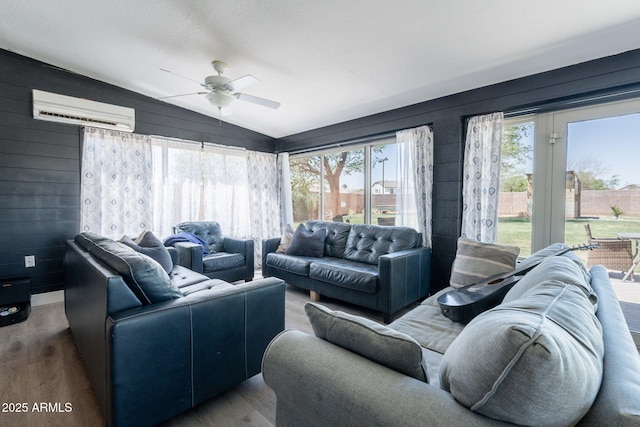21188 N Duncan Dr, Maricopa, AZ 85138 - living area with an AC wall unit, a ceiling fan, wood finished floors, vaulted ceiling, and wooden walls