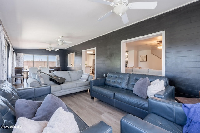 21188 N Duncan Dr, Maricopa, AZ 85138 - living area featuring wood finished floors, a ceiling fan, and wooden walls